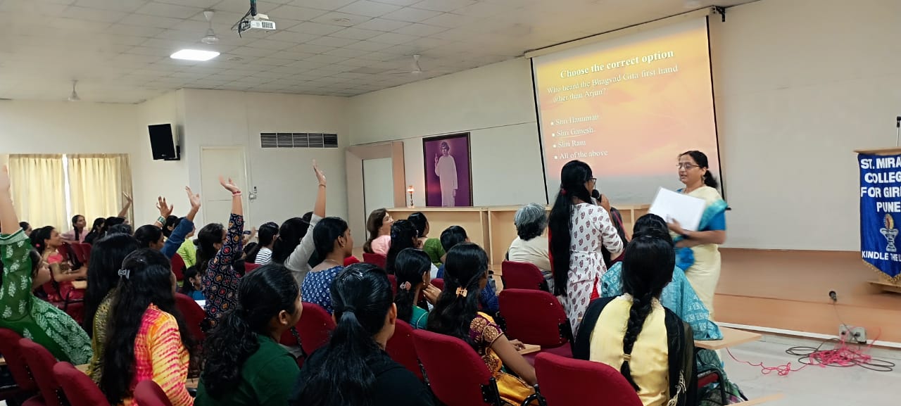 Participant of Prashna Manch giving an answer to a quiz question